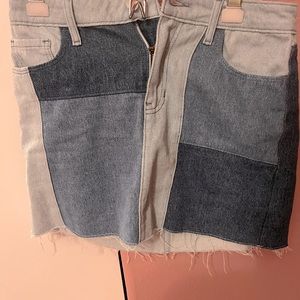 Retro Y2K mini skirt, with mismatched denim patches and a distressed hem